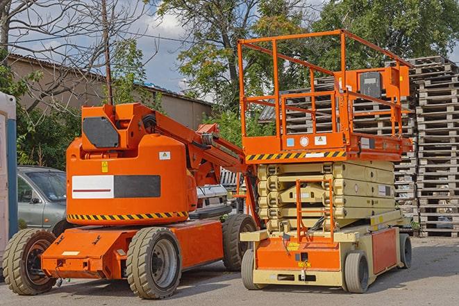 industrial forklift transporting goods in a warehouse setting in Columbia, CT